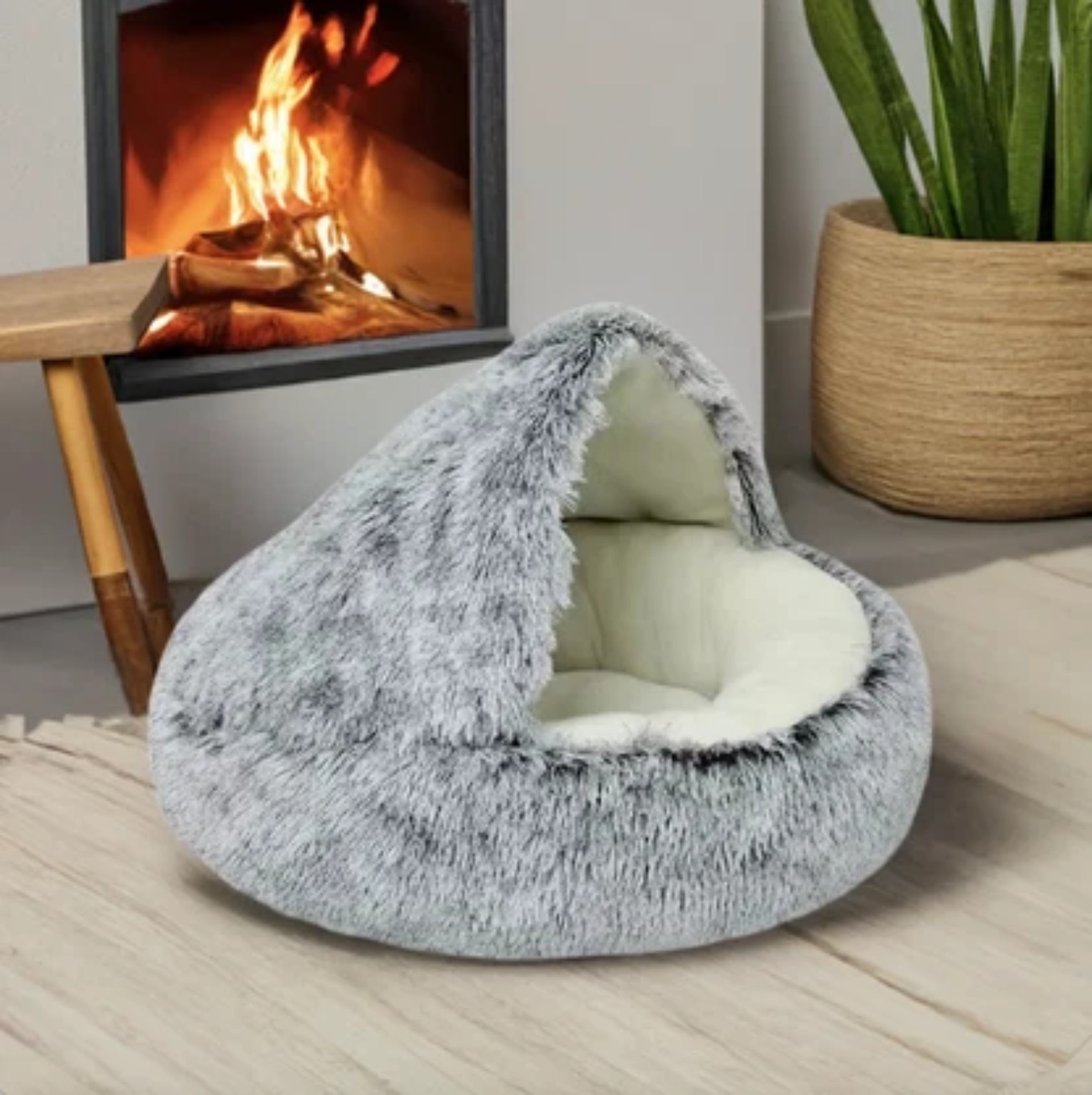 Gray plush pet bed in a cozy living room