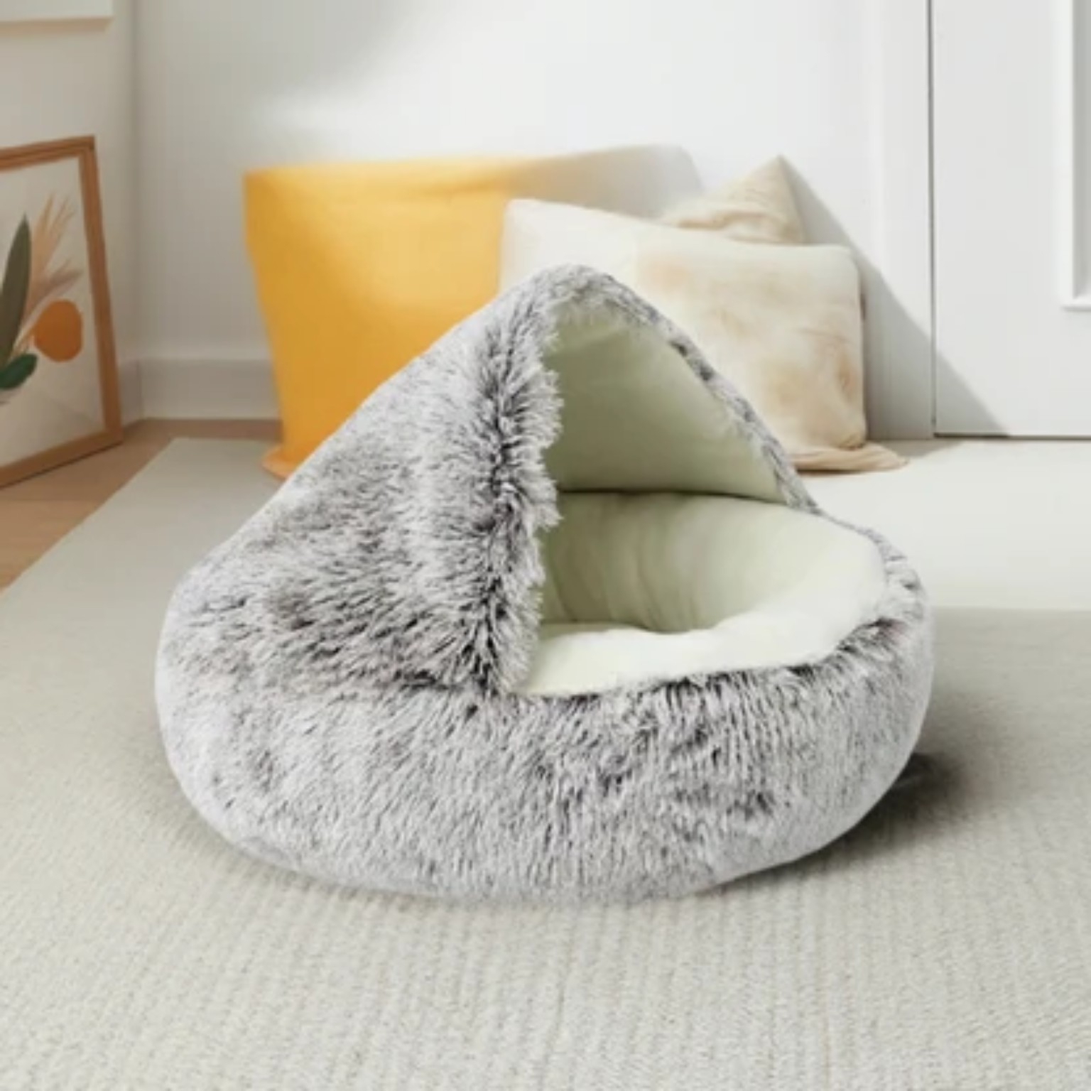 Gray plush pet bed in a bright room