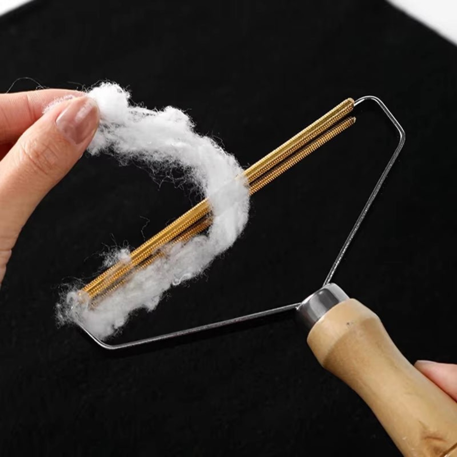 Mini Scraper lifting pet hair from fabric